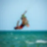 Kiteboarder executing a flip over water