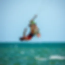 Kiteboarder executing a flip over water