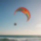 A close-up view of a colorful kitesurfing kite soaring in the sky