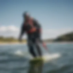 A kiteboarder showcasing a stylish dry suit in action on water