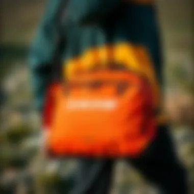 Portability for Adventurous Journeys Visual representation of the Dakine Kite Compression Bag being carried, highlighting its portability.