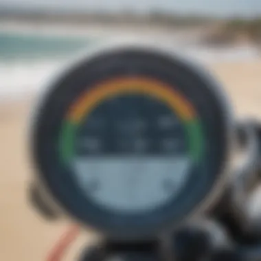 Close-up of water temperature readings displayed on a digital gauge with the beach in the background