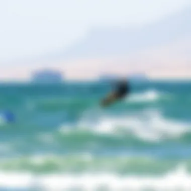 Kiteboarder gliding over the waves at Dolphin Beach