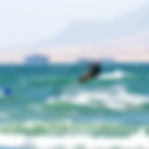 Kiteboarding at Dolphin Beach Kiteboarder gliding over the waves at Dolphin Beach