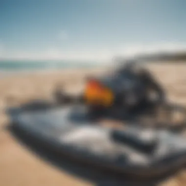 Close-up of advanced duotone kitesurfing gear arranged on the beach.