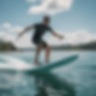 An individual expertly riding a SUP hydrofoil over crystal-clear water