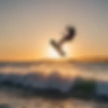 Kiteboarder riding the waves near Lake Worth Pier at sunset