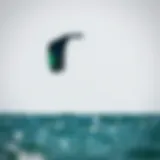 A Duotone kite soaring high above the water