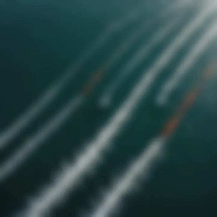 An aerial perspective of multiple kiteboarders hydro foiling in the ocean.