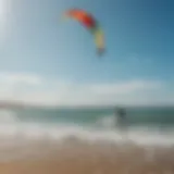 A vibrant kiteboarding scene with colorful kites soaring against a clear blue sky.