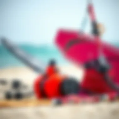 Close-up of essential kiteboarding equipment, including a kite and board, arranged neatly.