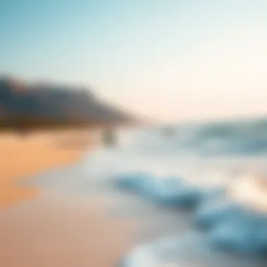 A picturesque beach destination ideal for kiteboarding, showcasing beautiful waves and clear skies.