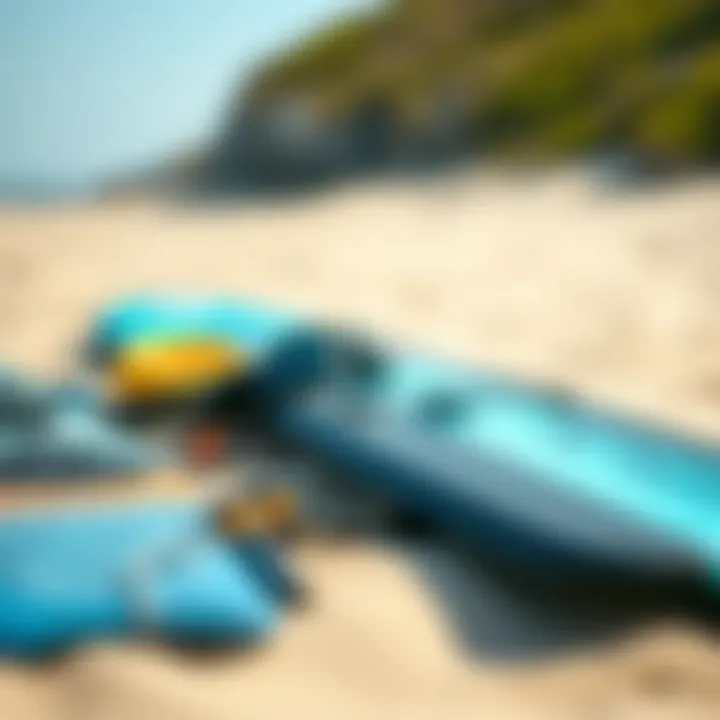 Essential Kitesurfing Gear A close-up of essential kitesurfing gear laid out on a sandy beach