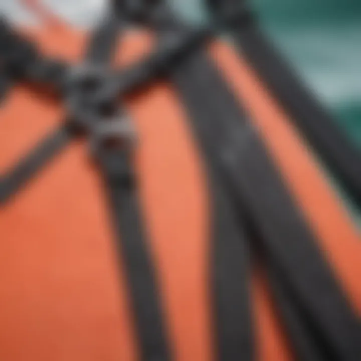 Close-up of a spreader bar attached to a kiteboarding harness, highlighting the connection point