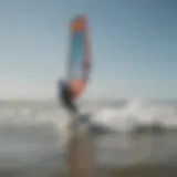 A kiteboarder gliding over the waves at St. Peter-Ording