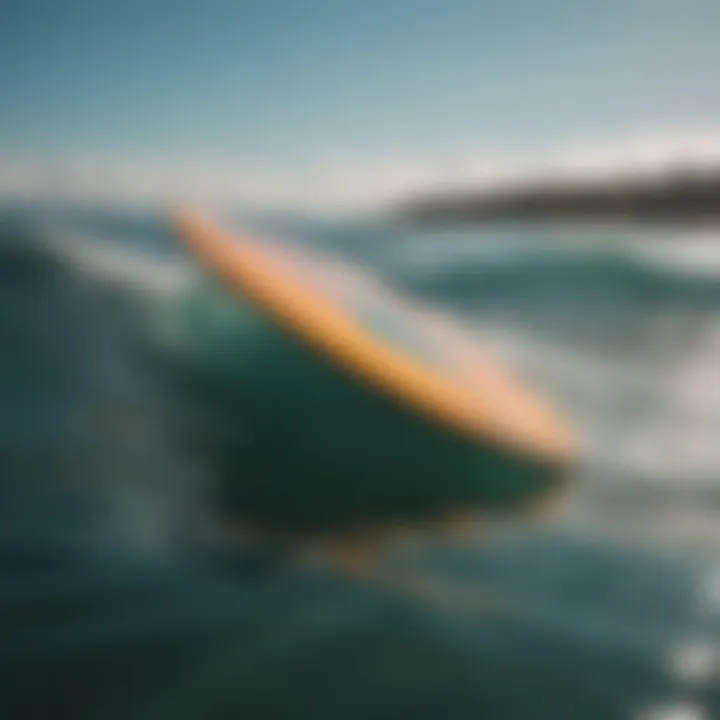 A surfboard with a foil gliding over the water surface