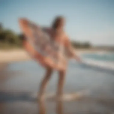 Stylish towel poncho in action at the beach