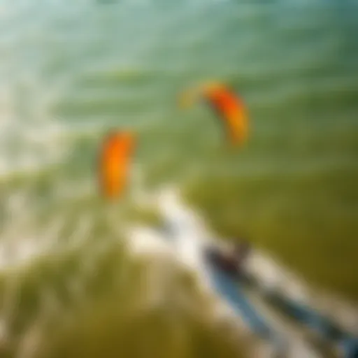 Aerial View of Kiteboarding Adventure An aerial view of kiteboarders showcasing vibrant kites against the ocean backdrop
