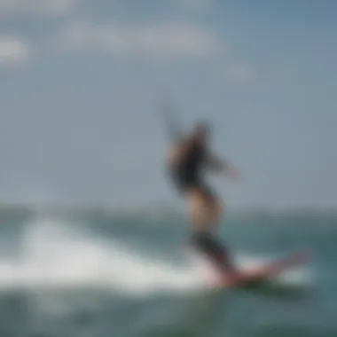 A kiteboarder performing tricks using a mini hydrofoil on the water