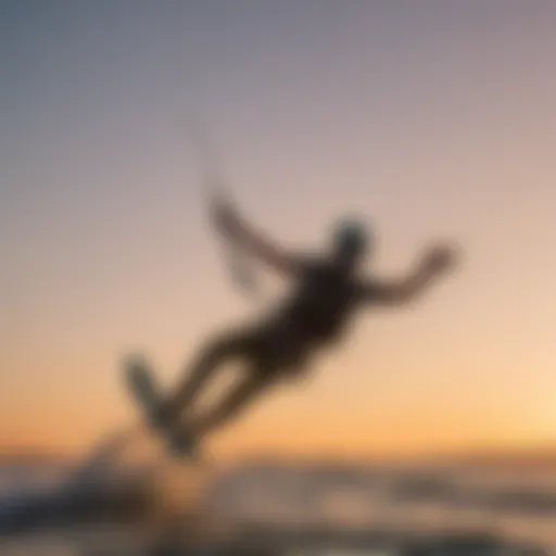 Kiteboarder foiling above the surface of the water at sunset