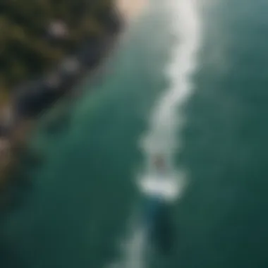 Stunning aerial view of kiteboarding in a vibrant ocean setting