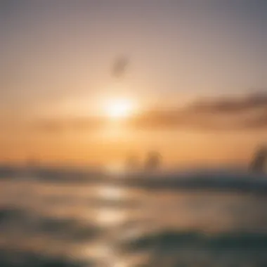 A tranquil sunset scene with kiteboarders harnessing the breeze in the background.