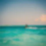 Kiteboarder gliding over turquoise waters of Holbox