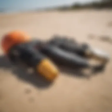 Essential Safety Gear for Kite Surfers Safety gear displayed on a sandy beach