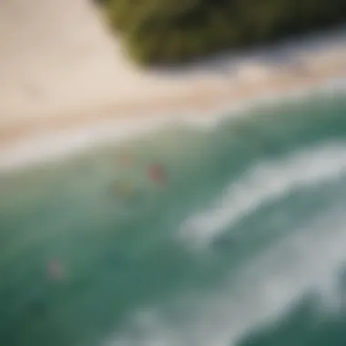 Aerial view of kite surfers launching their kites on a beach