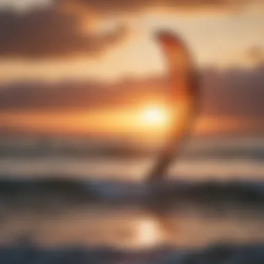 Kite surfers navigating the waves against a stunning sunset