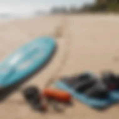 Essential kite surfing gear laid out on the beach.