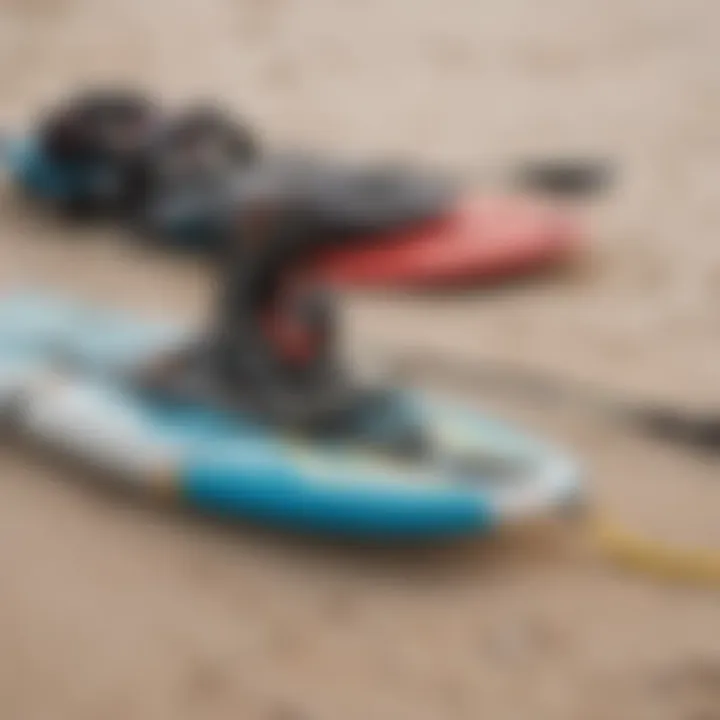 Essential kiteboarding gear laid out on the sandy shore