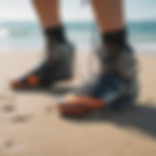 Close-up of kitesurf booties on the beach