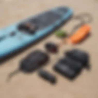 Close-up of kitesurfing gear laid out on the beach.