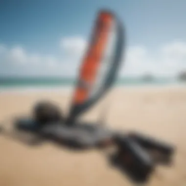 An array of kitesurfing equipment displayed on a beach