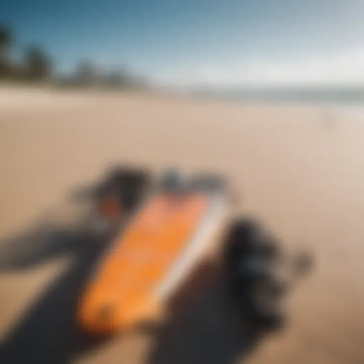 Kitesurfing gear laid out on the sand