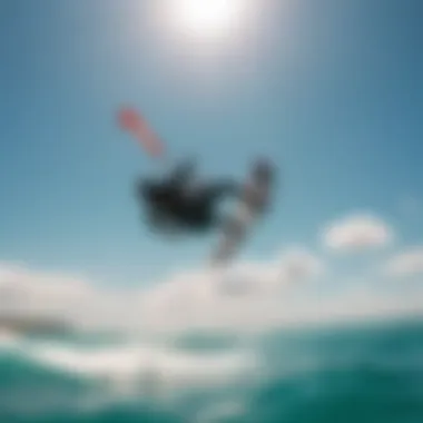 A kitesurfer soaring through the sky against a backdrop of clear blue waters and bright sunshine