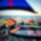 An array of kitesurfing equipment laid out on the beach