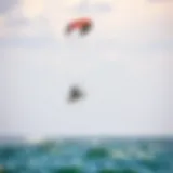 A vibrant kite soaring above the water during a kiteboarding session