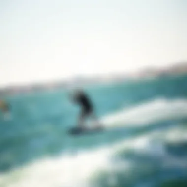 A kiteboarder gliding effortlessly over the water during a sunny day.