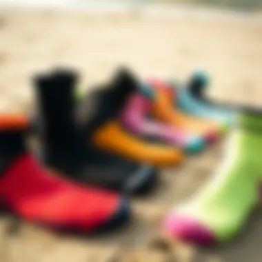 Variety of Neoprene Socks An array of neoprene socks in various colors and styles laid out on a sandy beach.