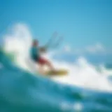 A vibrant kiteboarder carving through waves