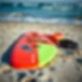Beginner wing foiling gear laid out on the beach
