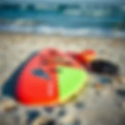 Beginner wing foiling gear laid out on the beach