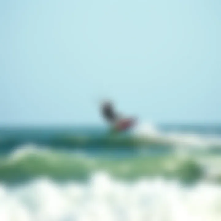 Kiteboarding at Sagamore Beach Kiteboarder gliding over ocean waves at Sagamore Beach