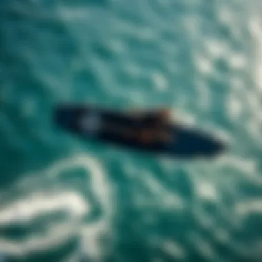 Aerial View of Sup Wing Foiling An aerial view of a sup wing foiler gliding over water