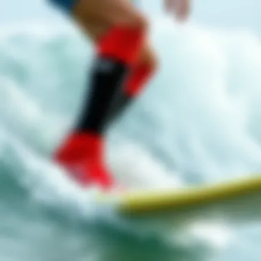 Surfer wearing neoprene socks in ocean waves