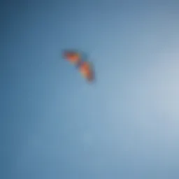 A dynamic two-line kite soaring against a clear blue sky.