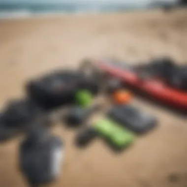 Essential kiteboarding gear laid out on a beach