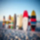 Different kiteboard sizes displayed on a beach
